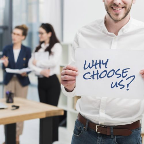 business-man-holding-paper-with-why-choose-us-question